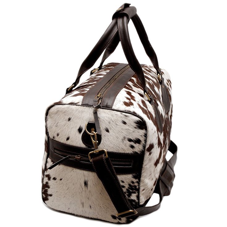 Experience luxury on the go with our exquisite spotted cowhide weekender bag. Add a touch of elegance to your travel essentials collection. * Free shipping on all our cowhide bags and purses. * Dimensions 20" long x 12" high x 11" wide (approx) * Detachable Shoulder Strap approx 40" long. Handle drop (from the middle) = 8" (Perfect to hold it or carry on shoulders) * All duffels are lined and have zipper pockets inside. * High Quality Cow Hide Leather * Double Stitched Seams * Thick Stitching * Thick Stitching, Quick Weekend Getaways, Cowhide Bag, Bags And Purses, Every Step You Take, Boho Living, Cow Hide, Boho Living Room, Weekender Bag