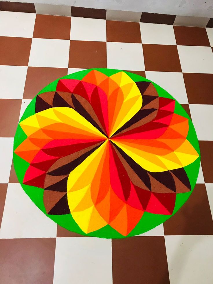 a colorful circular design on a checkered floor