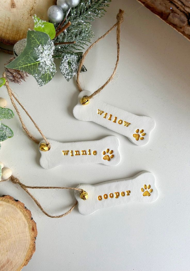 PLEASE ORDER BY FRIDAY 13th DECEMBER FOR DELIVERY IN TIME FOR CHRISTMAS!  Handmade personalised dog bone clay Christmas decoration, perfection Christmas tree ornament for dog lovers! Please consider delivery times when ordering. Items may take longer to ship as they are personalised and made to order  Size: Height: 3cm Width: 8.5cm (Lenght of ornament when hanging is approx 16cm) Please note that each piece will be unique and may have slight imperfections due to the nature of air dry clay.  Thes Air Dry Clay Decorations Christmas, Clay Christmas Baubles, Air Clay Decorations, Dog Christmas Tree Decorations, Polymer Clay Baubles, Christmas Ornaments Air Dry Clay, Xmas Clay Decorations, Diy Gifts For Dog Lovers, Clay Dog Ornament