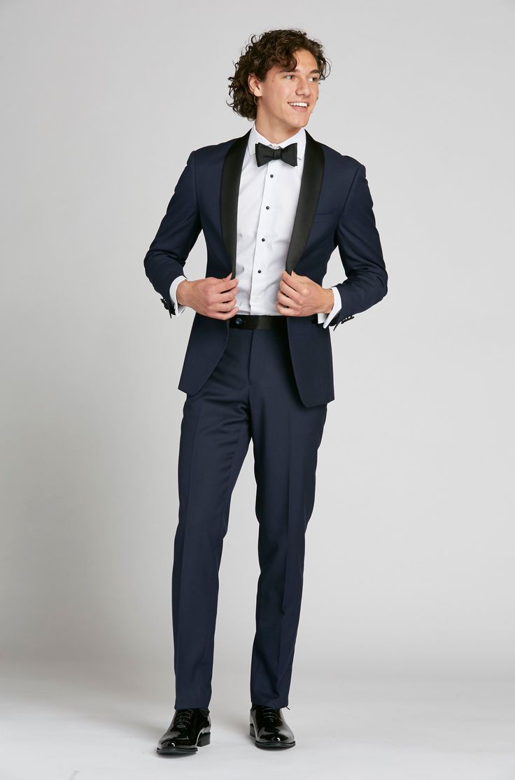 Think timeless, classic tuxedo, and then turn it up. The navy shawl lapel tuxedo is a true style piece, both unexpected and endlessly sharp. A satin, black shawl lapel is set against deep navy blue for a refined contrast. Navy Double Breasted Tuxedo With Notch Lapel, Elegant Fitted Navy Tuxedo, Classic Tailored Navy Tuxedo, Luxury Fitted Navy Tuxedo, Navy Notch Lapel Tuxedo, Navy Blue Tuxedo, Navy Tuxedo, Shawl Lapel Tuxedo, Navy Shawl