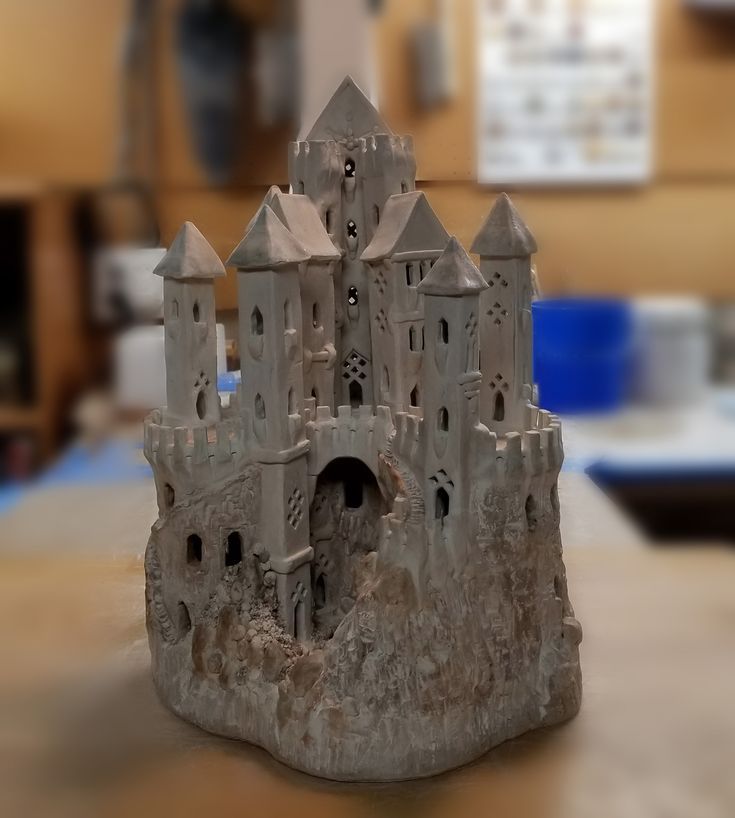 a castle made out of clay sitting on top of a table