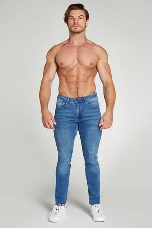 Premium Stretch Jeans in Light Blue - TAILORED ATHLETE Fitted Nylon Gym Bottoms, Fitted Nylon Bottoms For Gym, Casual Fitted Training Bottoms, Casual Fitted Bottoms For Training, Fitted Nylon Training Bottoms, Functional Nylon Fitted Bottoms, Fitted Blue Nylon Bottoms, Fitted Functional Blue Bottoms, Fitted Mid-rise Activewear For Training