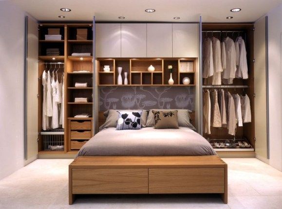 a bed sitting in a bedroom next to a walk in closet