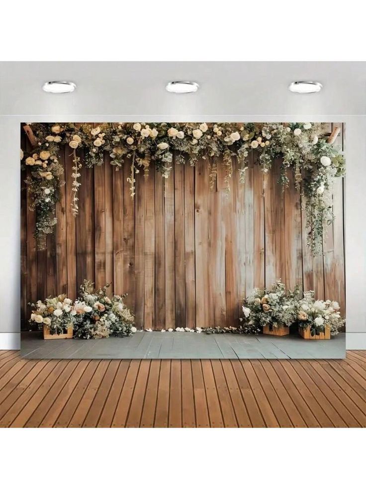 a wooden wall with flowers and greenery on it