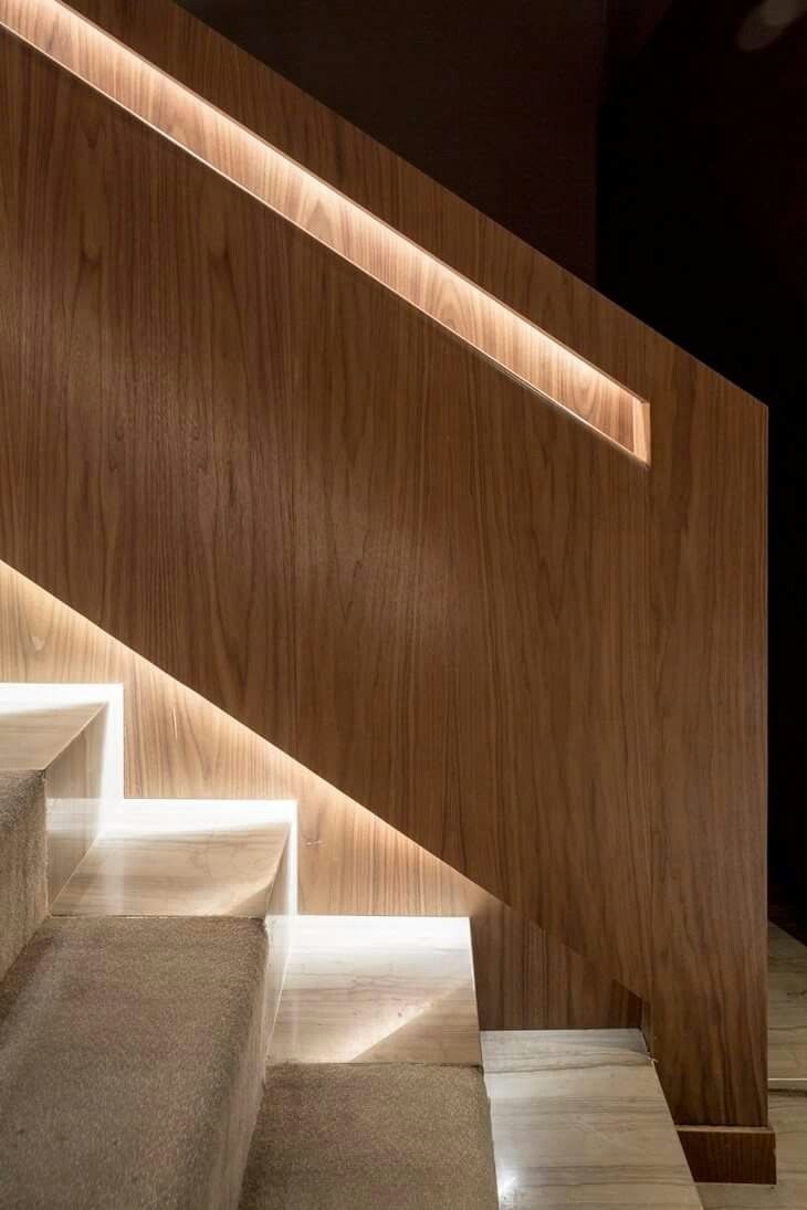 the stairs are made of wood and have led lights on them to illuminate light