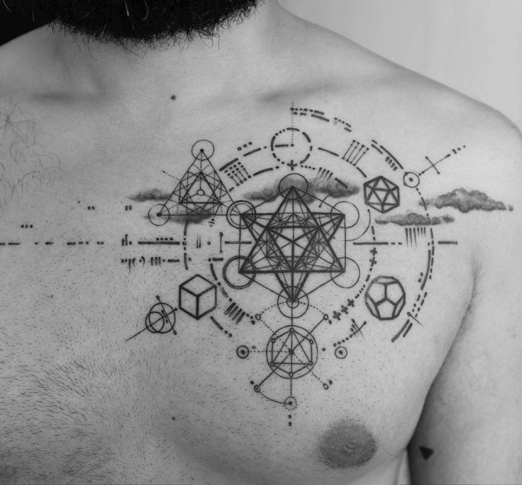 a man's chest with geometric designs on it