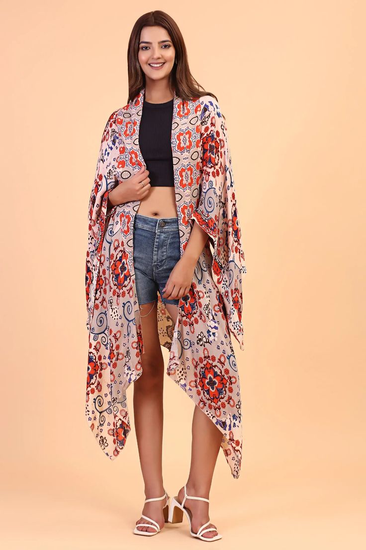 Our kimono features a back cut-out detail with a floral paisley pattern. It features a lightweight and breathable fabric to ensure comfort. Style over your favorite swimsuit for a stylish beach cover-up. One Size Multicolor Boho Print Kimono, Multicolor Printed Kimono For Day Out, Bohemian Multicolor Patterned Kimono, Bohemian Patterned Multicolor Kimono, One Size Multicolor Summer Kimono, Multicolor Open Front Kimono For Day Out, Multicolor Boho Print Free Size Kimono, Multicolor Boho Print Free-size Kimono, Multicolor Free Size Boho Print Kimono