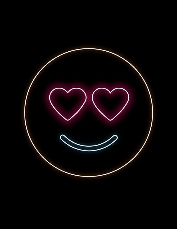 a neon smiley face with two hearts on it