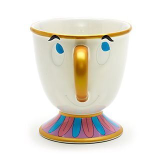 a cup with a face painted on the side and a gold nose sticking out from it