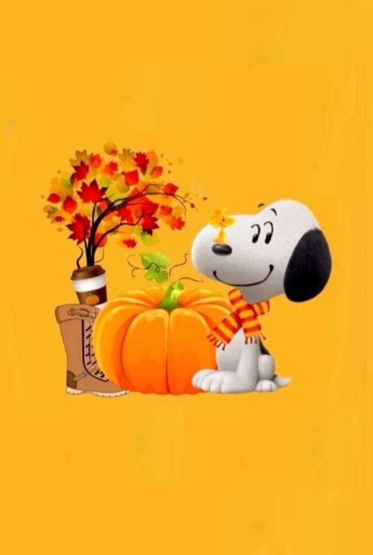 a cartoon dog sitting next to a pumpkin