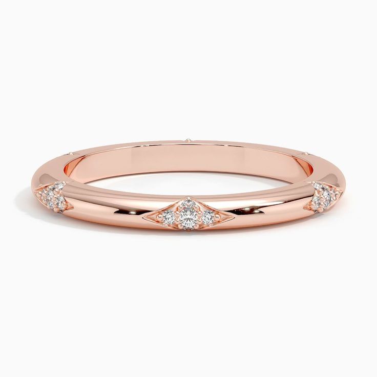 Alula Diamond Wedding Ring - 14K Rose Gold. Clusters of round diamonds in lotus-inspired impressions form a unique eternity-style design reminiscent of constellations in the night sky in this shining ring (1/8 total carat weight). Fine Jewelry Diamond Stackable Rings In Rose Gold, Rose Gold Diamond Stackable Rings Fine Jewelry, Fine Jewelry Rose Gold Diamond Stackable Rings, Elegant Moissanite Stackable Rings, Luxury Rose Gold Wedding Ring With Diamond Accents, Luxury Wedding Stackable Rings With Single Cut Diamonds, Rose Gold Diamond Stackable Rings, Round Band, Elegant Stackable Rings With Rose Cut Diamonds, Luxury Rose Gold Stackable Rings With Rose Cut Diamonds