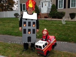 a man in a fireman's costume standing next to a child on a toy firetruck