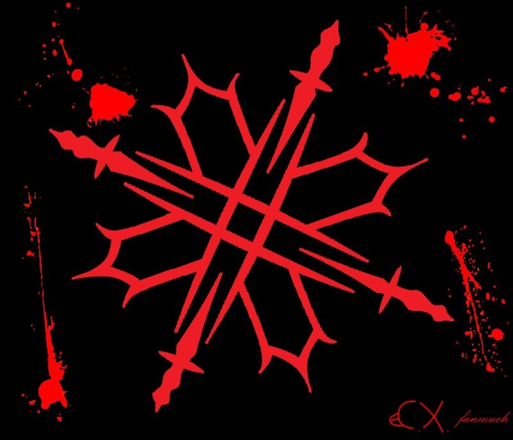 a red snowflake on a black background with paint splattered around it