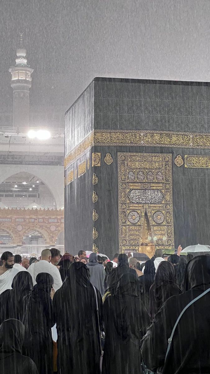 a group of people standing in the rain