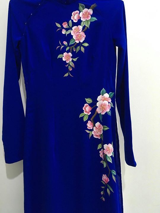 a blue dress with pink flowers on it