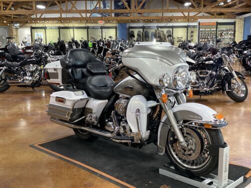 several motorcycles are parked in a large building