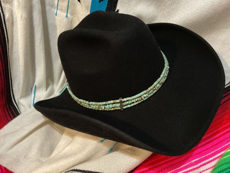 A great statement piece for your cowboy hat.  This handmade cowboy hat hatband is made with turquoise color magnesite, howlite or chalk turquoise beads. Silver color accent beads are added to compliment the color. The chain and s hook closure make it adjustable.  Just a little added touch with a lucky horseshoe charm.  Beaded length: 21" (with conchos) Chain: 7" FREE SHIPPING Thank you for shopping KactusKatsBoutique 🌵 Favor my shop to get notices of new items Watch for cowboy boot Christmas stockings Lucky Horseshoe, S Hook, Cowboy Boot, Hat Band, Cowboy Hat, Turquoise Color, Turquoise Beads, Accent Colors, Cowboy Boots