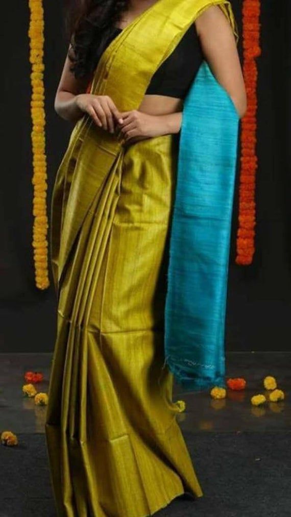 Allover double dyed ghicha Tussar silk saree with Blouse Piece Product Details : Saree Type : lemon green based with firoza pallu Saree with blouse piece Blouse Piece : Yes (Un-Stitched) Saree Length : 5.5 Meters Blouse Piece Length : 1 Meters Saree Weight : 0.300 kg Saree Fabric : Pure Tussar silk Color : As shown in the picture Work : weaving Pattern : Solid Occasion: Party Wear, Formal Wear, Festival Wear , Marriage Function Wear, Casual Wear, Regular Use. Washing Instructions : Dry Clean Onl Yellow Tussar Silk Pre-draped Saree For Diwali, Green Raw Silk Pre-draped Saree With Self Design, Green Tussar Silk Blouse Piece For Puja, Green Slub Silk Blouse For Festivals, Festival Green Slub Silk Blouse Piece, Yellow Slub Silk Saree With Unstitched Blouse, Green Tussar Silk Handloom Blouse Piece, Green Handloom Tussar Silk Blouse Piece, Green Slub Silk Saree