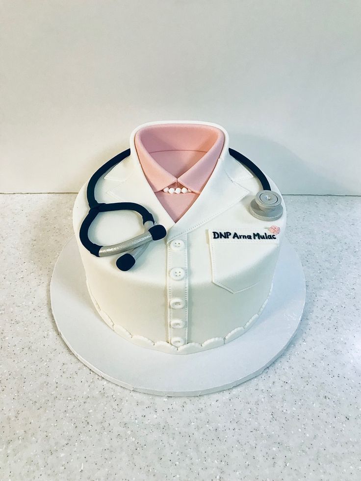 a cake with a doctor's shirt and stethoscope on top