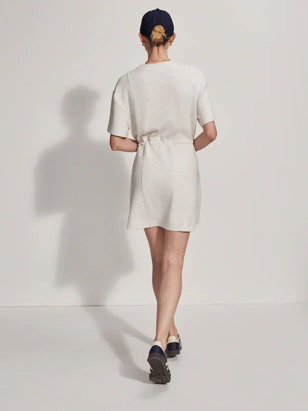 Crew neck t-shirt style dress This Above-the-knee piece features a waist cinch with toggles, side pockets, and seam detailing Maple Dress, Tiered Midi Skirt, Boys Swimwear, Shirt Dress Style, T Shirt Style, Long Crop Top, Summer Staples, Casual Coat, Ladies Boutique