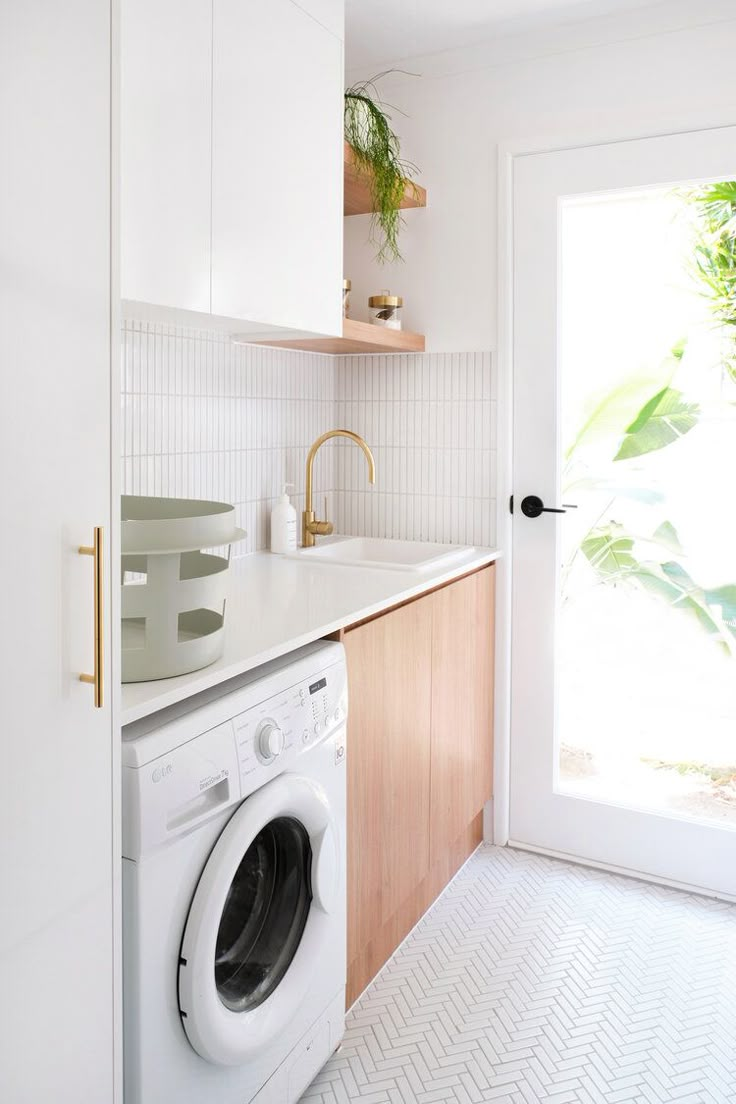 a washer and dryer in a small kitchen