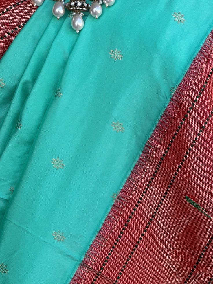 This Muniya border paithani saree from Pure Paithani is an exquisite choice for any special occasion. Its intricate embroidery is skillfully crafted, adding a traditional touch to your wardrobe. It is a perfect way to embody grace and sophistication. fall & pico done blouse size 38-42 Bollywood Style Paithani Silk Pre-draped Saree For Puja, Festival Paithani Silk Pre-draped Saree With Zari Work, Dola Silk Pre-draped Saree With Embroidered Border For Puja, Festival Paithani Silk Pre-draped Saree With Cutdana, Celebration Handloom Chanderi Pre-draped Saree, Festive Semi-stitched Handloom Pre-draped Saree, Traditional Pre-draped Saree With Border, Traditional Festive Pre-draped Saree With Border, Festive Banarasi Silk Pre-draped Saree With Border