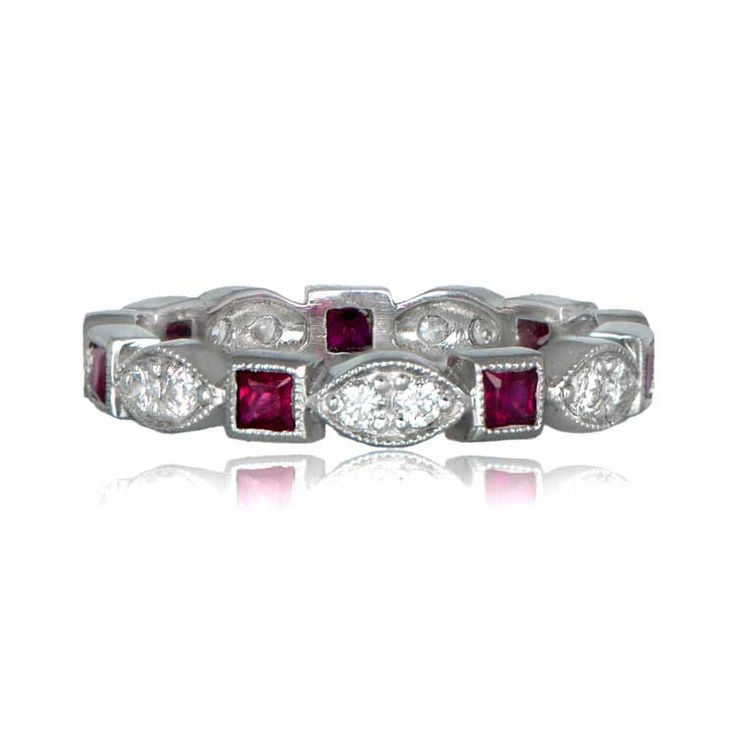 A beautiful vintage style wedding band, adorned with diamonds and French-cut rubies and mounted in a stunning platinum setting. Classic Red Diamond Ring With Single Cut Diamonds, Classic Red Ruby Ring With Single Cut Diamonds, Classic Eternity Band With Rose Cut Diamonds, Classic Ruby Eternity Band For Formal Occasions, Elegant Red Round Cut Eternity Band, Classic Diamond White Eternity Band With Rose Cut Diamonds, Classic Marquise Ruby Ring With Brilliant Cut, Classic Ruby Ring With Rose Cut Diamonds For Wedding, Classic Platinum Ruby Ring For Anniversary