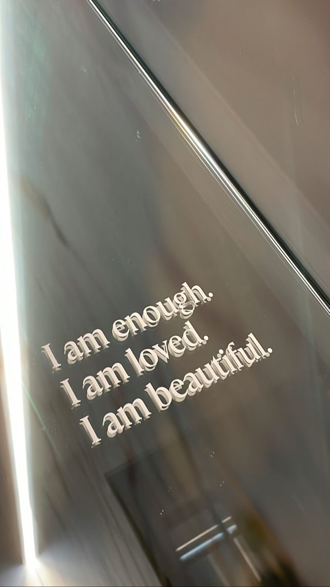 an etched glass plaque with the words i am enough, i am loved, i am beautiful