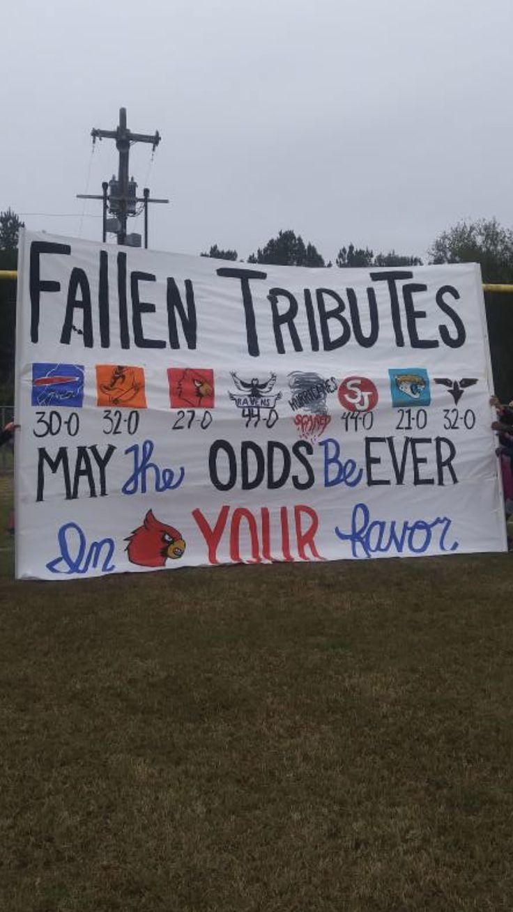 a sign that says fallen tributes may the odds be ever on your favorite team