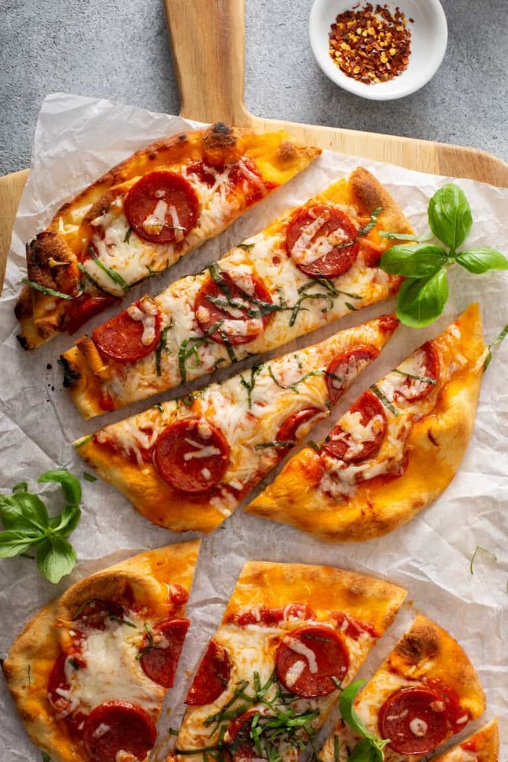 pepperoni flatbread pizza is cut into slices