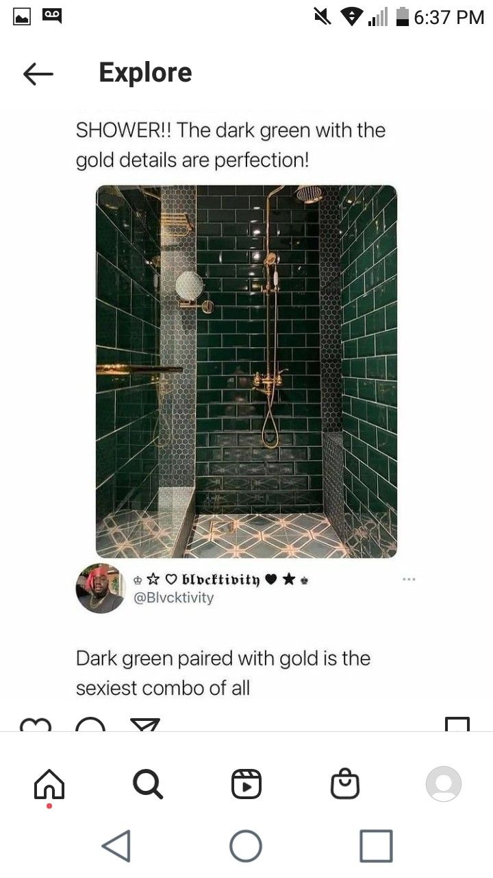 a green tiled shower with black and white tile on the walls, and an image of a shower head