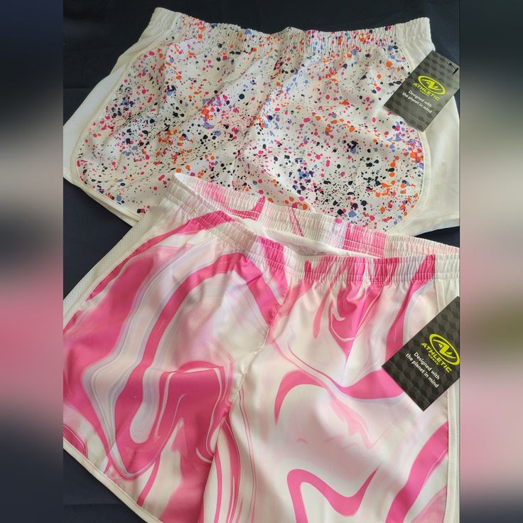 two pairs of pink and white shorts with sprinkles on them