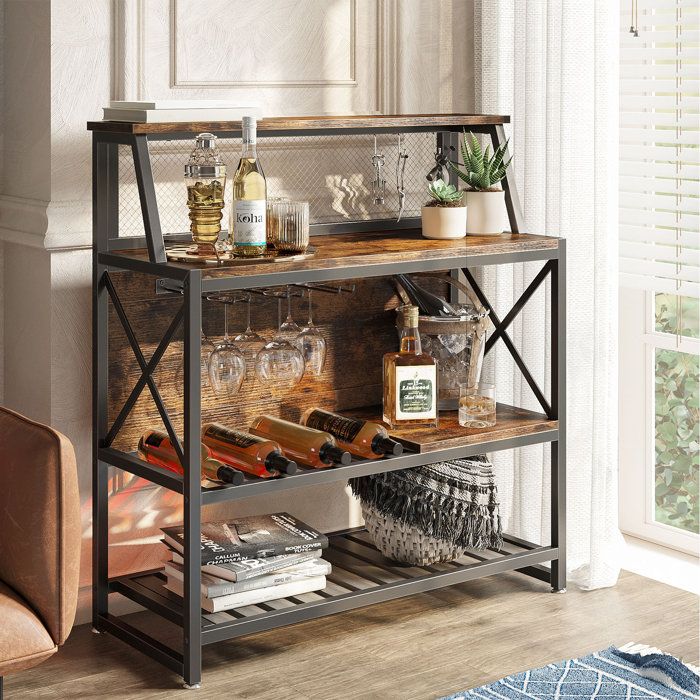 a shelf with wine glasses and bottles on it