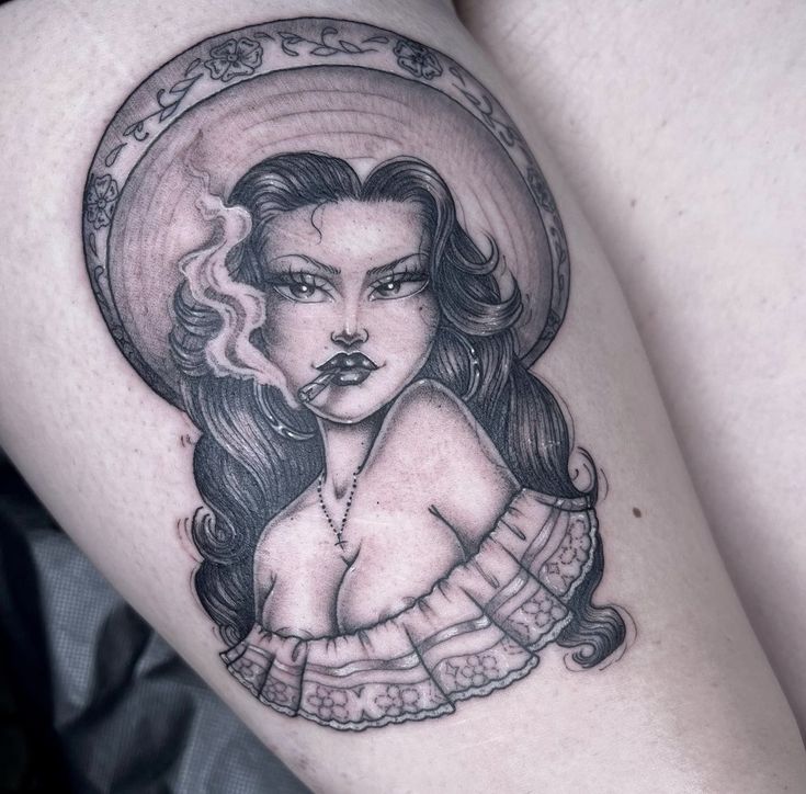 a woman's thigh with a tattoo on it