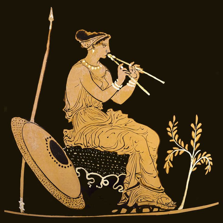 an ancient greek vase with a woman playing the flute