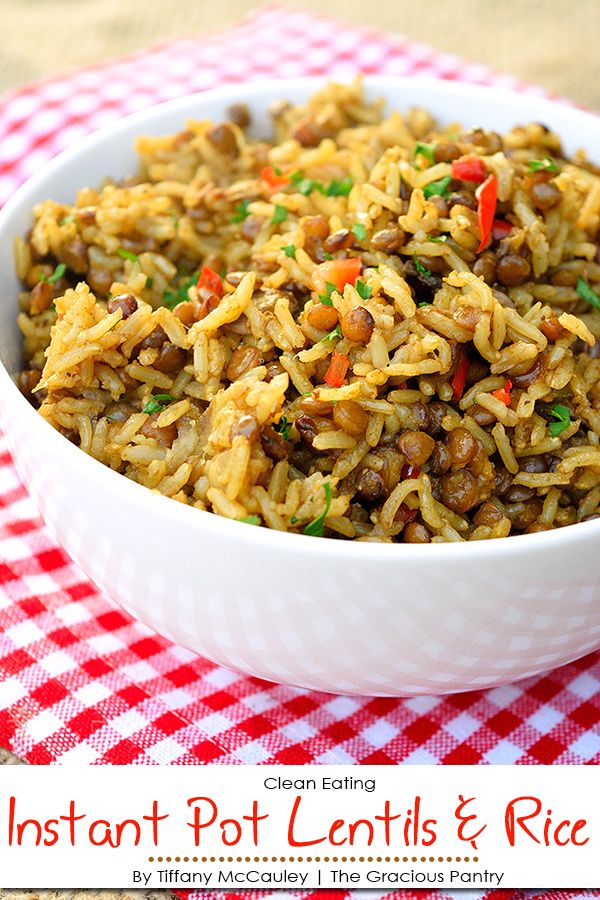 instant pot lentils and rice in a white bowl on a red checkered tablecloth