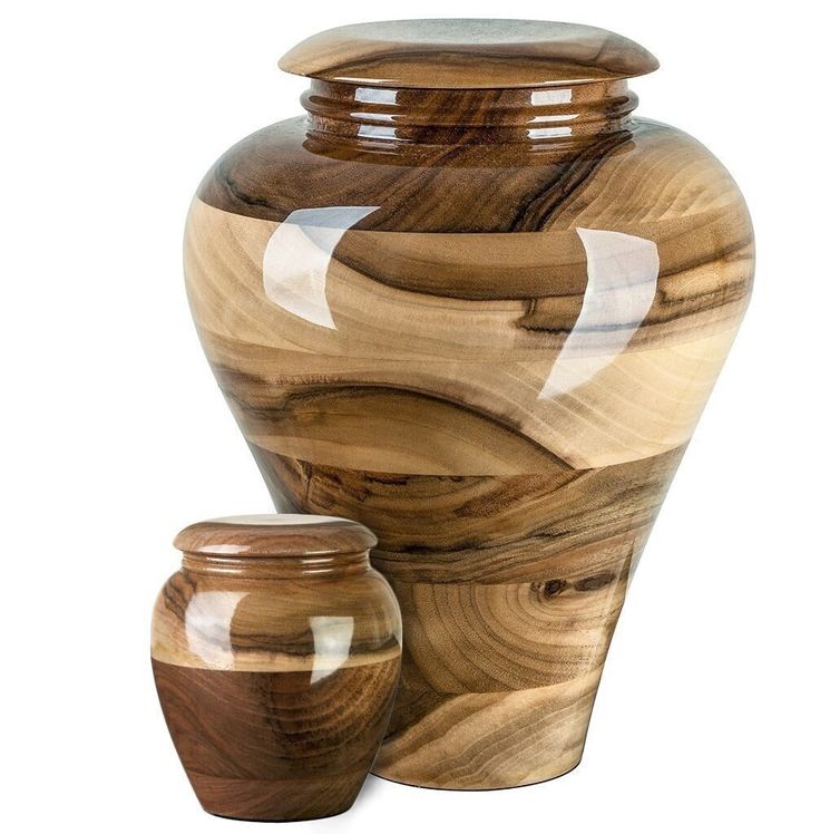 two wooden vases sitting next to each other