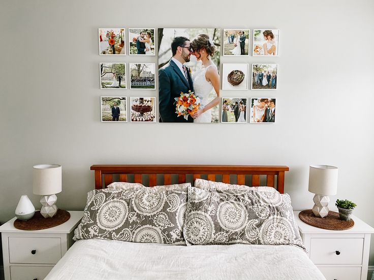 a bed with pictures on the wall above it