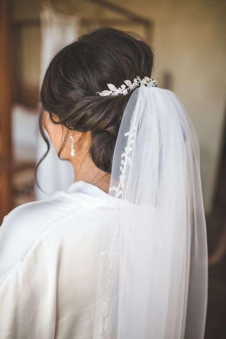 the back of a bride's head wearing a veil