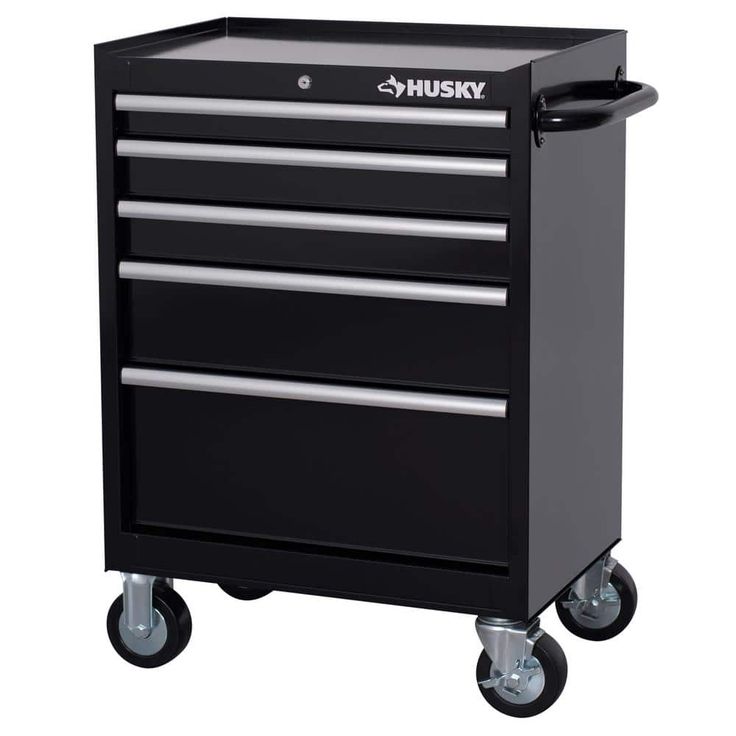 the husky tool cabinet is on wheels and has three drawers, one with four drawers