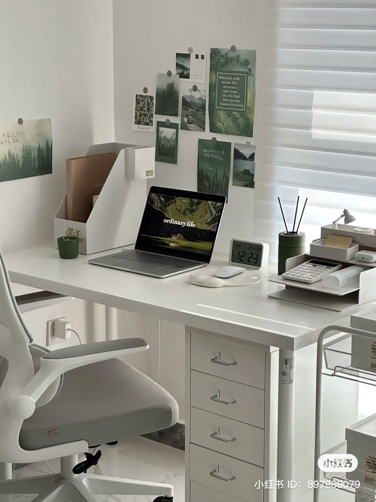 a white desk topped with a laptop computer