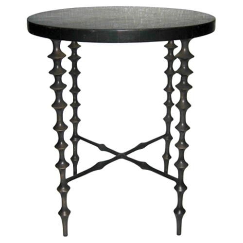 an iron table with black marble top