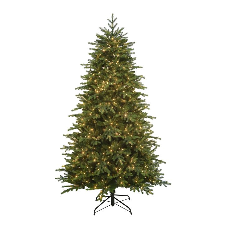 a large christmas tree with lights on it's base and stand in front of a white background