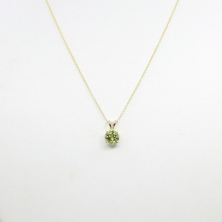 ◈ Diamond Fine Jewelry ◈ ♥ This stunning necklace features 7 mm AAA Natural Peridot. This high quality Peridot can be beautifully set in a solid 14k Yellow gold. This Necklace is perfect for everyday use and can be a lovely gift for any occasion! ♥ ◈ Item Details ◈ --- Handmade in United States --- Made to Order --- Metal: Solid 14K Gold ( White, Rose, Yellow Gold ) --- Pendant Size :12 x7 mm --- 100% Real Natural Peridot --- Stone Size : 7 mm --- Stone Shape : Round --- Total Carat Weight: Appr Dainty Diamond Band, August Birthstone Necklace, Peridot Pendant, Solitaire Necklace, Peridot Necklace, Peridot Stone, August Birthstone, Solitaire Necklaces, Rose Yellow