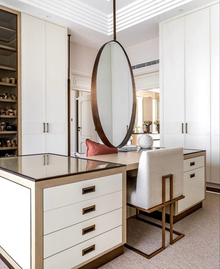 a large mirror hanging over a kitchen island