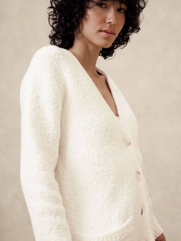 Wrap yourself in the ultimate comfort with our Boucle Cardigan. Boucle yarn has a nubby textured appearance and is our warmest stitch. V-neck. Long sleeves. Button front closure. Front pockets. Ribbed neck, arm cuffs and hem. Straight hem. Made exclusively for Banana Republic Factory. #514724 Arm Cuffs, Boucle Yarn, Arm Cuff, Banana Republic Factory, Banana Republic, Cardigans, Long Sleeves, Yarn, V Neck