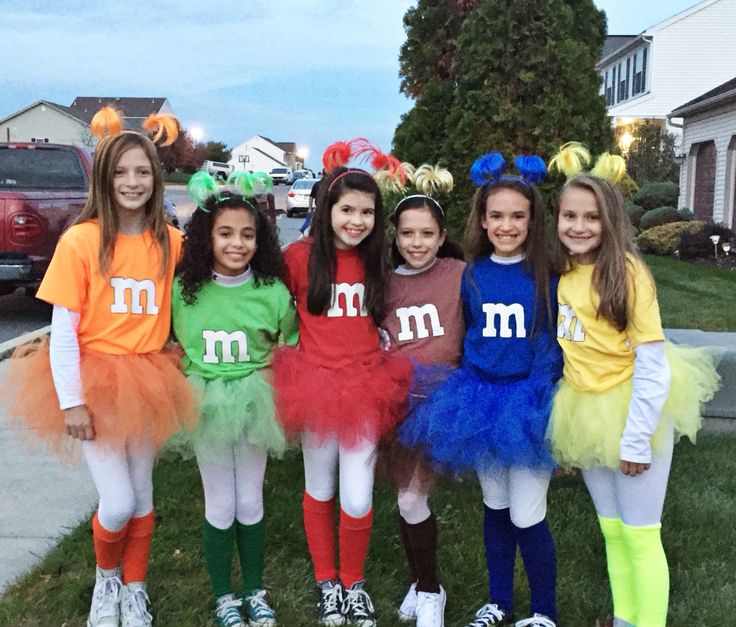 the girls are dressed up in costumes for halloween