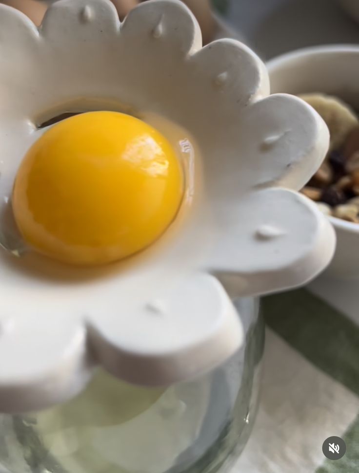 an egg in the center of a flower vase