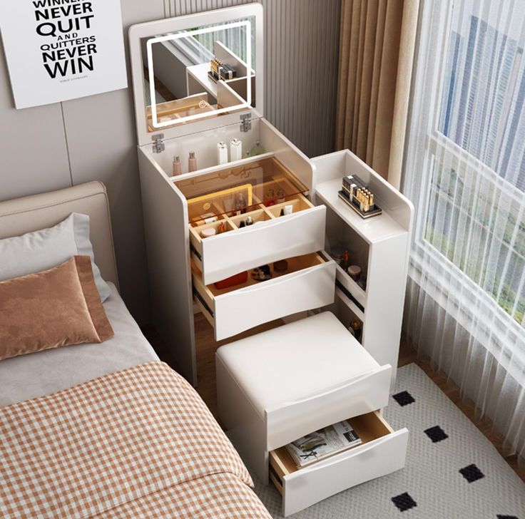 a bedroom with a bed, dresser and mirror next to a window in the room