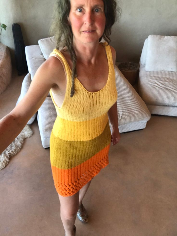 This dress is a fun colorful item for your summer walk or dinner. It fits comfortably over a bra top and leggins or bare.  Definitely an eye catcher and something to brighten your day. Size medium It's handmade on a manual knitting machine. Summer Knit Stretch Dress, Stretch Knit Summer Dress, Summer Stretch Knit Dress, Stretch Crochet Beach Dress, Bohemian Stretch Crochet Dress For Summer, Summer Bohemian Stretch Crochet Dress, Summer Stretch Knit Crochet Dress, Summer Knitted Dresses, Multicolor Crochet Dress For Summer